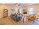 Comfortable living room with stylish furniture, a fireplace, and abundant natural light at 257 Orwell Dr, Social Circle, GA 30025