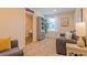 Cozy living room with neutral tones, comfortable seating, and ample natural light showcasing relaxation and style at 257 Orwell Dr, Social Circle, GA 30025