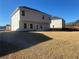 Spacious backyard with new sod and a view of neighboring homes at 333 Orwell Dr, Social Circle, GA 30025