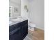 Simple bathroom with single vanity and toilet at 333 Orwell Dr, Social Circle, GA 30025