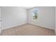 Bright bedroom with neutral walls and carpet at 333 Orwell Dr, Social Circle, GA 30025