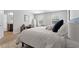 Main bedroom with ensuite bathroom access and a large bed at 333 Orwell Dr, Social Circle, GA 30025