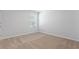 Bright bedroom with neutral walls and carpet at 333 Orwell Dr, Social Circle, GA 30025