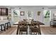 Bright dining room with farmhouse table and natural light at 333 Orwell Dr, Social Circle, GA 30025
