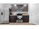 Modern kitchen with stainless steel appliances and granite countertops at 333 Orwell Dr, Social Circle, GA 30025