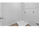 Bright laundry room with built-in shelving and drain at 333 Orwell Dr, Social Circle, GA 30025
