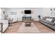 Open living room with wood-look floors and comfortable seating at 333 Orwell Dr, Social Circle, GA 30025