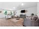 Open living room featuring wood-look flooring and neutral decor at 333 Orwell Dr, Social Circle, GA 30025