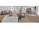 Open concept living and dining area with wood-look floors at 333 Orwell Dr, Social Circle, GA 30025