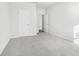 Bright bedroom with plush gray carpet and plenty of natural light at 6900 Winchester Pl, Fairburn, GA 30213