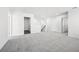 Spacious loft area with plush carpeting and multiple doorways at 6900 Winchester Pl, Fairburn, GA 30213