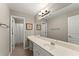 Bathroom featuring vanity with sink and storage, large mirror, and separate water closet at 2352 Kelman Pl, Dacula, GA 30019