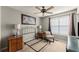 Bedroom with neutral carpet, ceiling fan, and a large window provides lots of natural light at 2352 Kelman Pl, Dacula, GA 30019