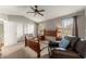 This bedroom boasts a ceiling fan, natural light from multiple windows, and ample closet space at 2352 Kelman Pl, Dacula, GA 30019