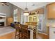 Bright dining area with table and chairs, and open views to the living room and kitchen at 2352 Kelman Pl, Dacula, GA 30019