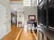 Sunlit entryway with hardwood floors and decorative console table at 2352 Kelman Pl, Dacula, GA 30019