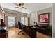 Bright home office with dark wood floors, a ceiling fan, and ample natural light at 2352 Kelman Pl, Dacula, GA 30019