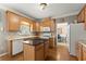 Well-equipped eat-in kitchen featuring modern appliances, lots of cabinet space, and hardwood floors at 2352 Kelman Pl, Dacula, GA 30019