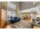 Open-concept floorplan with a large living room leading into the kitchen and dining area, perfect for entertaining at 2352 Kelman Pl, Dacula, GA 30019