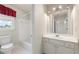 Well-lit bathroom with a tub and shower, vanity, and tiled floors at 2818 Colleton Dr, Marietta, GA 30066