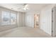 Bright bedroom with neutral carpet and a large closet with a bathroom nearby at 2818 Colleton Dr, Marietta, GA 30066