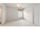 The bedroom has a ceiling fan, neutral carpet, and natural lighting from a window at 2818 Colleton Dr, Marietta, GA 30066