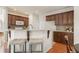 Kitchen featuring granite counters, breakfast bar, and dark wood cabinets at 2818 Colleton Dr, Marietta, GA 30066