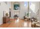 Open living room with hardwood floors, high ceilings, and views to the dining room at 2818 Colleton Dr, Marietta, GA 30066