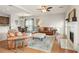 Open-concept living room with hardwood floors, a fireplace, and comfortable seating at 2818 Colleton Dr, Marietta, GA 30066