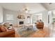 Bright living room featuring a fireplace, hardwood floors, and an open floor plan at 2818 Colleton Dr, Marietta, GA 30066