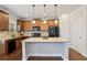 Well-equipped kitchen featuring granite countertops, a center island, and modern appliances at 6120 Sparrow Ln, Cumming, GA 30028