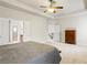Generous main bedroom features neutral walls, a tray ceiling, and closet access at 6120 Sparrow Ln, Cumming, GA 30028