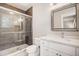 Clean bathroom with white vanity, a glass shower, and dark tile floors at 5341 Hill Nw Rd, Acworth, GA 30101