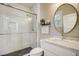 Elegant bathroom with white subway tiles, an oval mirror, and modern fixtures at 5341 Hill Nw Rd, Acworth, GA 30101