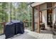 Deck with built-in grill and access to a screened porch at 5341 Hill Nw Rd, Acworth, GA 30101