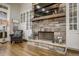Stone fireplace in the living room with built-in shelving units at 5341 Hill Nw Rd, Acworth, GA 30101