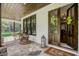 Inviting front porch with rocking chairs and a stone patio at 5341 Hill Nw Rd, Acworth, GA 30101