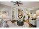 Gathering room with hardwood floors, comfortable seating, and views to kitchen at 5341 Hill Nw Rd, Acworth, GA 30101