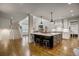 Spacious kitchen with island, stainless steel appliances, and hardwood floors at 5341 Hill Nw Rd, Acworth, GA 30101