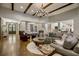 Open-concept living room with hardwood floors and a large sectional sofa at 5341 Hill Nw Rd, Acworth, GA 30101