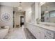 Luxurious bathroom with double vanity, marble floors, and a large soaking tub at 5341 Hill Nw Rd, Acworth, GA 30101