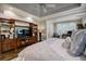 Main bedroom with built-in entertainment center and hardwood floors at 5341 Hill Nw Rd, Acworth, GA 30101