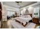 Spacious main bedroom with sitting area, hardwood floors, and coffered ceiling at 5341 Hill Nw Rd, Acworth, GA 30101