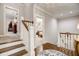 Upstairs hall with hardwood floors and access to bedrooms at 5341 Hill Nw Rd, Acworth, GA 30101
