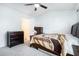 Bright bedroom featuring a ceiling fan, carpet flooring, and ample space for furniture arrangement at 2804 Parkway Cv, Lithonia, GA 30058
