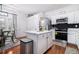 Kitchen with island, stainless steel appliances, and dining space at 2804 Parkway Cv, Lithonia, GA 30058