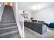 Living room with a stairwell and plenty of space for entertaining at 2804 Parkway Cv, Lithonia, GA 30058