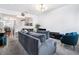 Open-concept living room offers natural light, neutral tones, and a seamless flow into the dining and kitchen areas at 2804 Parkway Cv, Lithonia, GA 30058