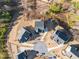 Aerial view showcasing a cul-de-sac with houses and surrounding landscape at 514 Perdue Trl, Canton, GA 30115