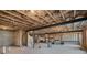 Unfinished basement with exposed ceiling and beams, presenting ample space for customization at 514 Perdue Trl, Canton, GA 30115